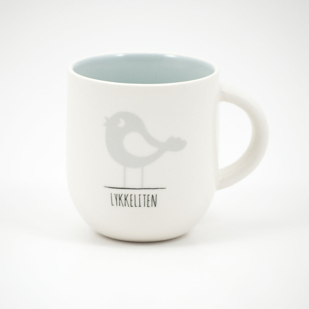 Kopp porselen Hvit med tekst: Lykkeliten lys blå Motiv: se bildet.